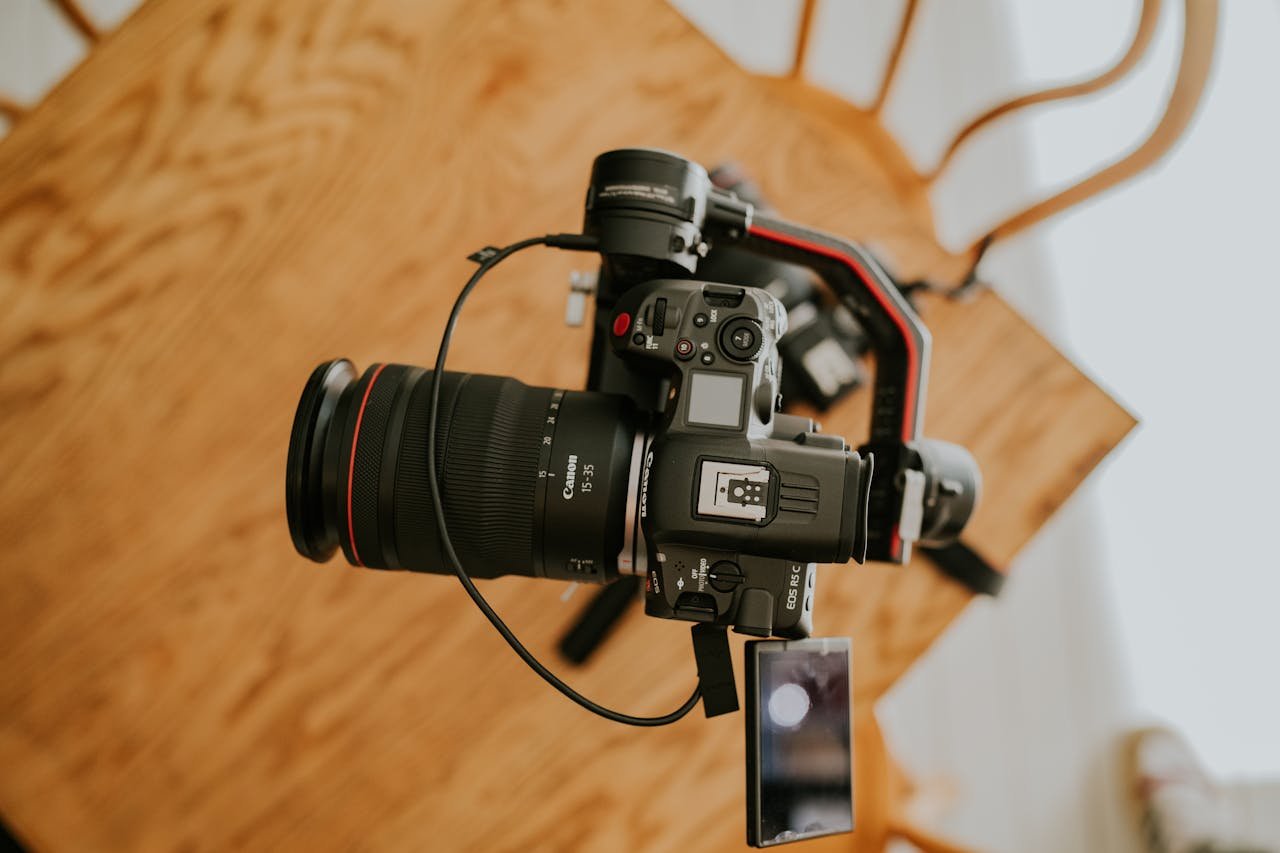 portfolio-img-10 Top view of a professional camera setup on a tripod indoors, perfect for photography enthusiasts.